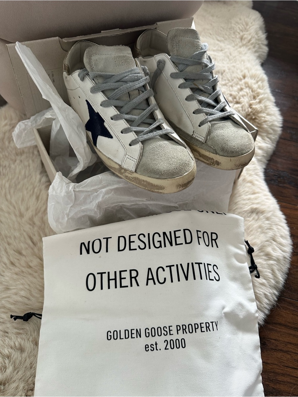 Golden Goose white leather sneakers with navy star and gray accents